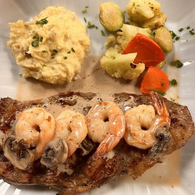 Rib Eye Steak and Prawns Plate.